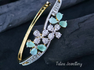 An open-hinged designer Floral CZ Elegance Openable Kada in glossy gold-tone alloy, paved with AAA cubic-zirconia petals and pear-cut colour stones.